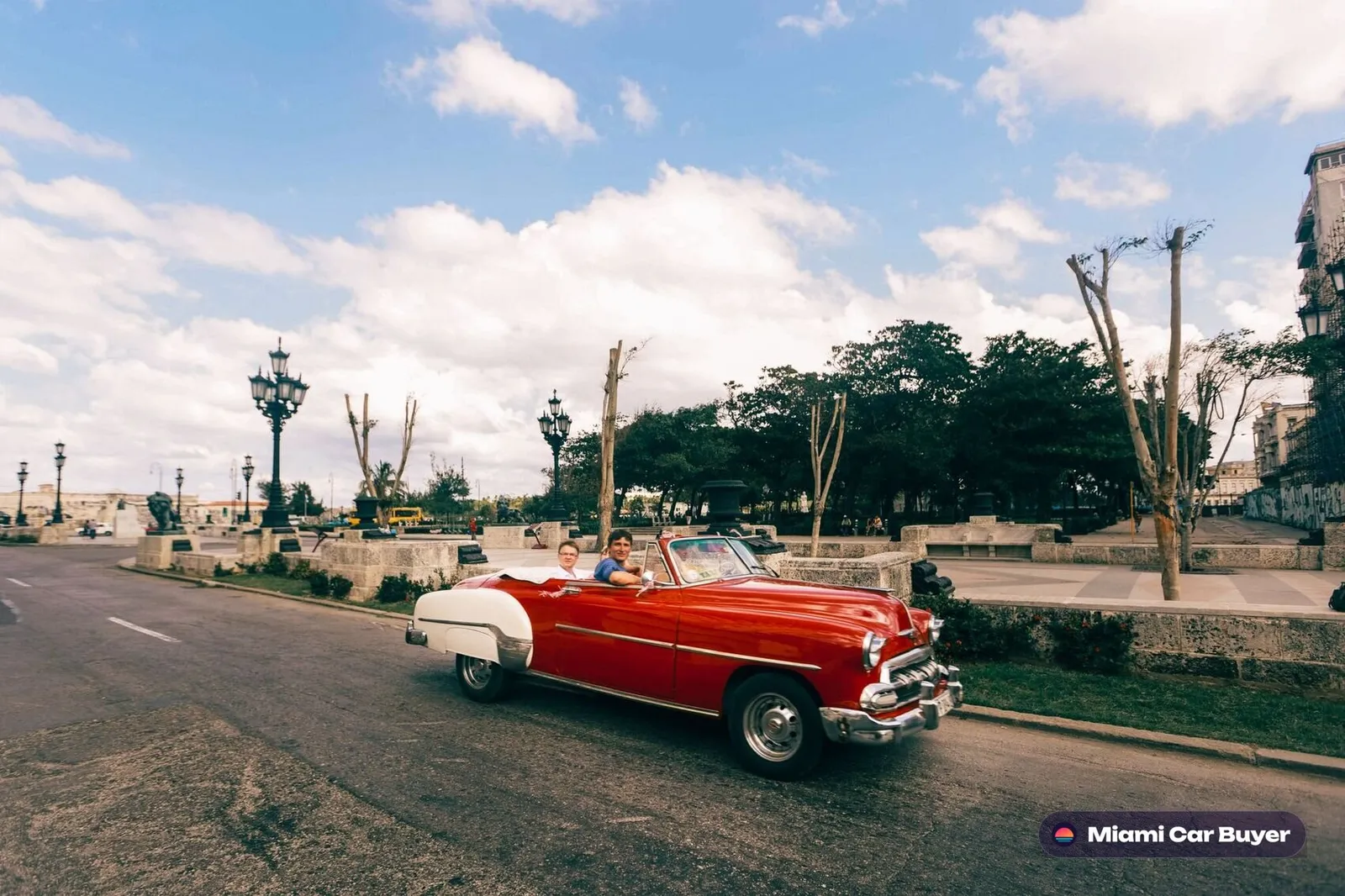 Red classic convertible on a sunny Miami road