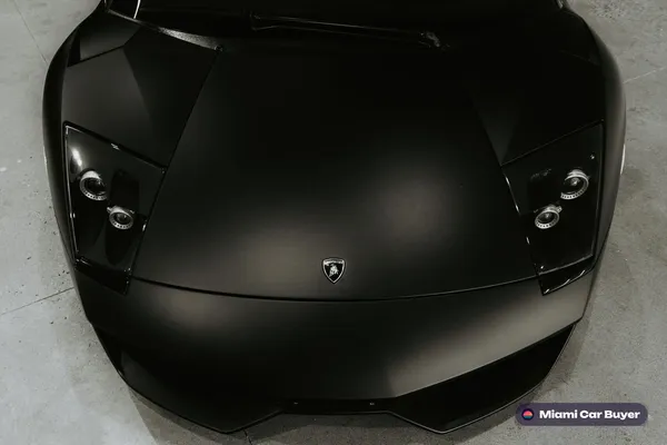 Matte black sports, the kind of car sold for cash across Miami-Dade