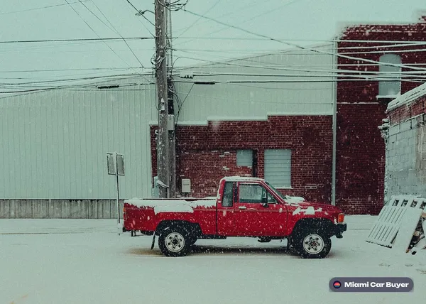 Red pickup, the kind of car sold for cash across Miami-Dade