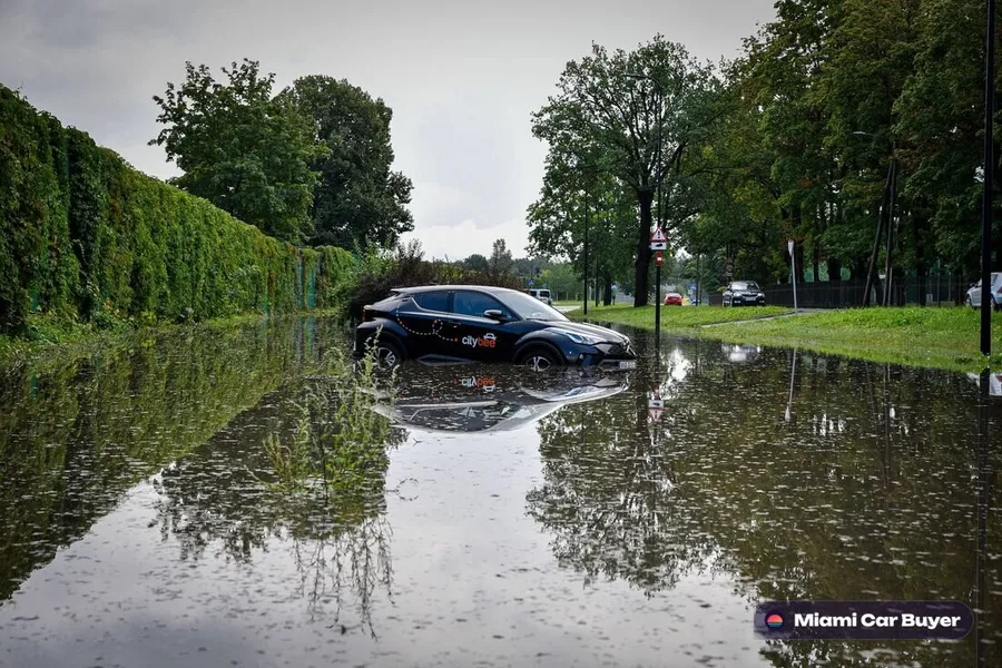 Flood damaged car on a Little Havana street after a storm