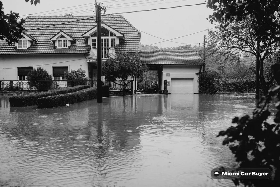 Cars sitting in hurricane storm surge water on a flooded Miami street