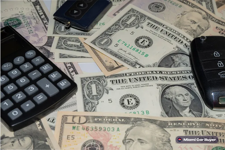 Person counting cash payment beside a car in Miami, illustrating the locked offer cash-at-pickup promise